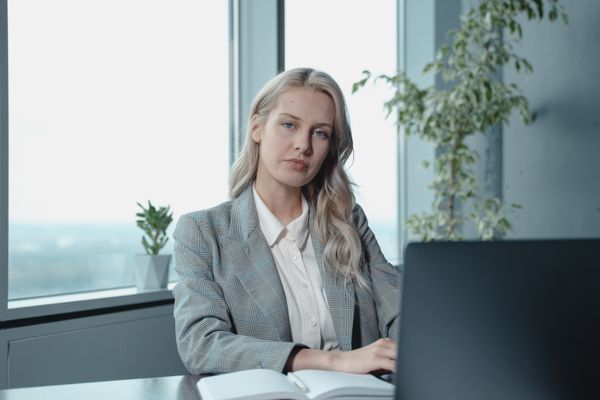 Woman working at an office desk — photo by Tima Miroshnichenko on Pexels