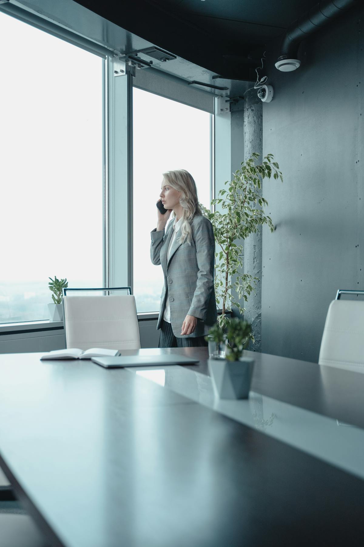 Person studying near a window with plants, conveying a calm and mindful atmosphere