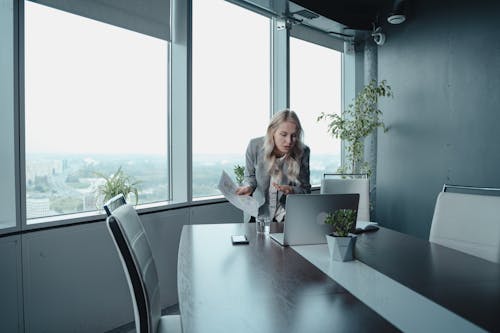 Woman In Gray Blazer In A Video Meeting