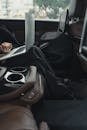 Person Seated At The Back Seat Using Macbook