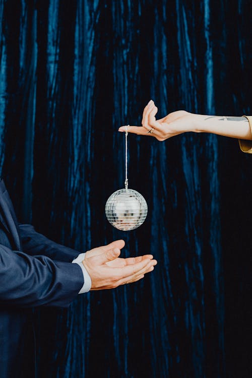 A Person Holding a Disco Ball