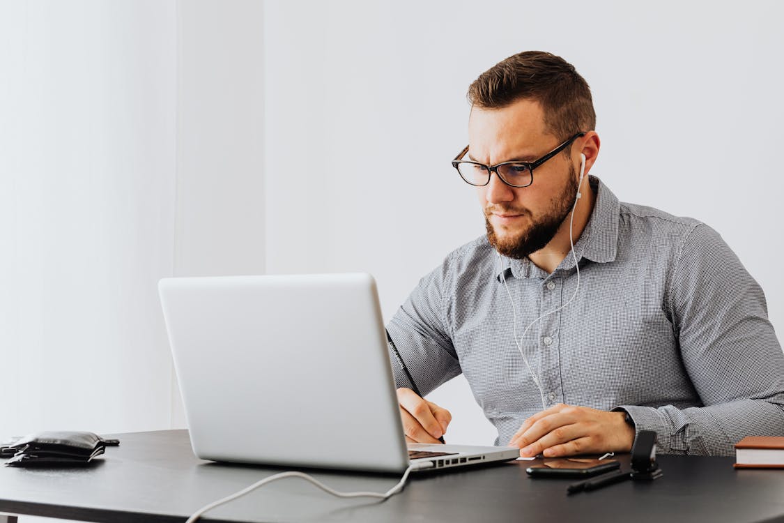 A Man Sitting at the Table · Free Stock Photo