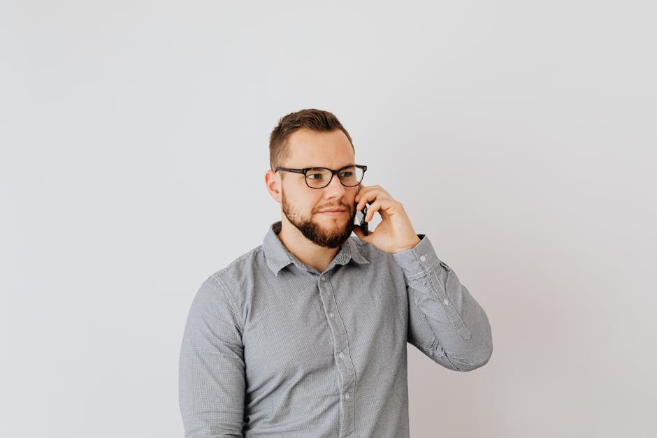 happy customer in a modern, bright repair shop receiving their flawlessly repaired iPhone 17 Pro from a friendly technician