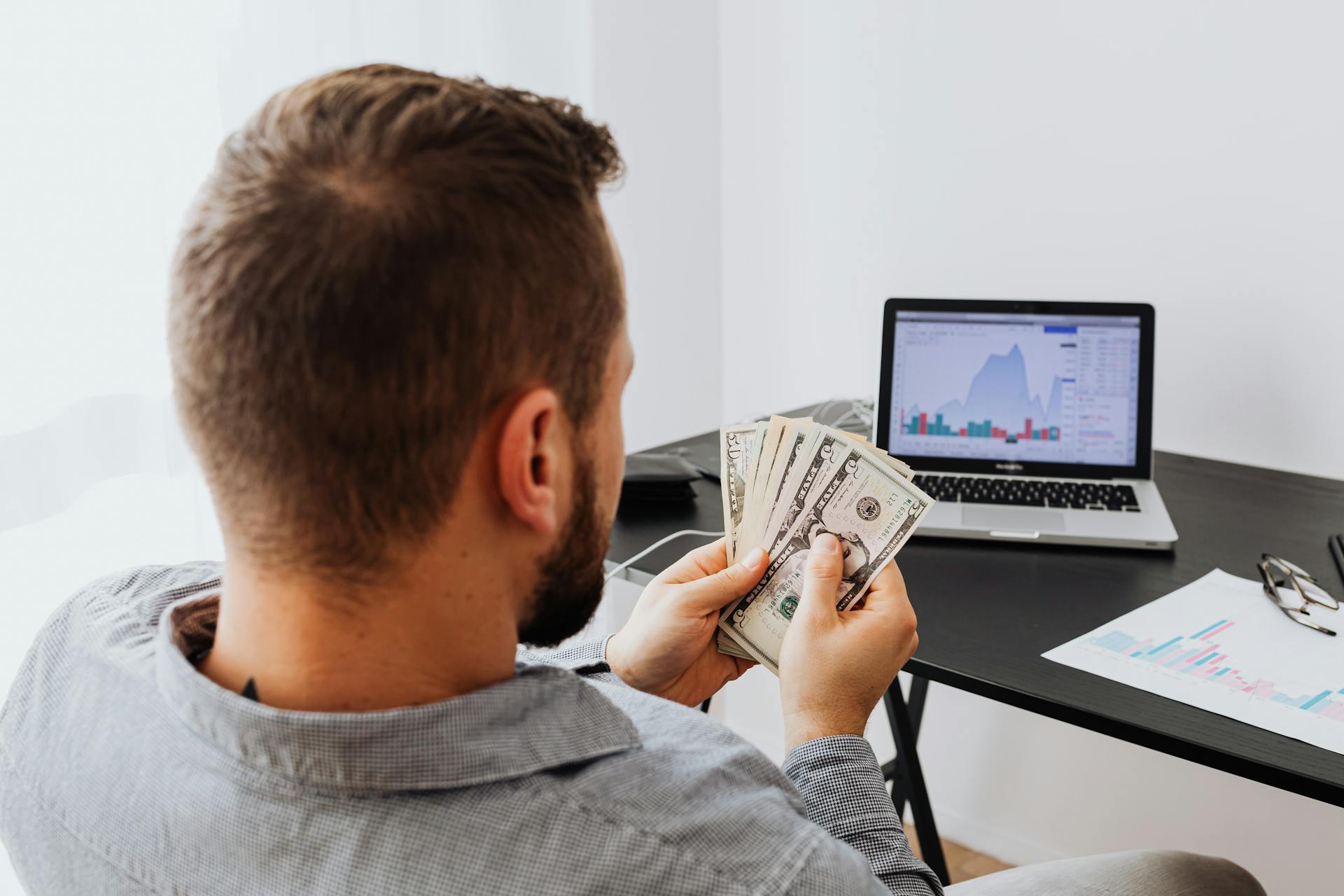 A Man Holding Bank Notes