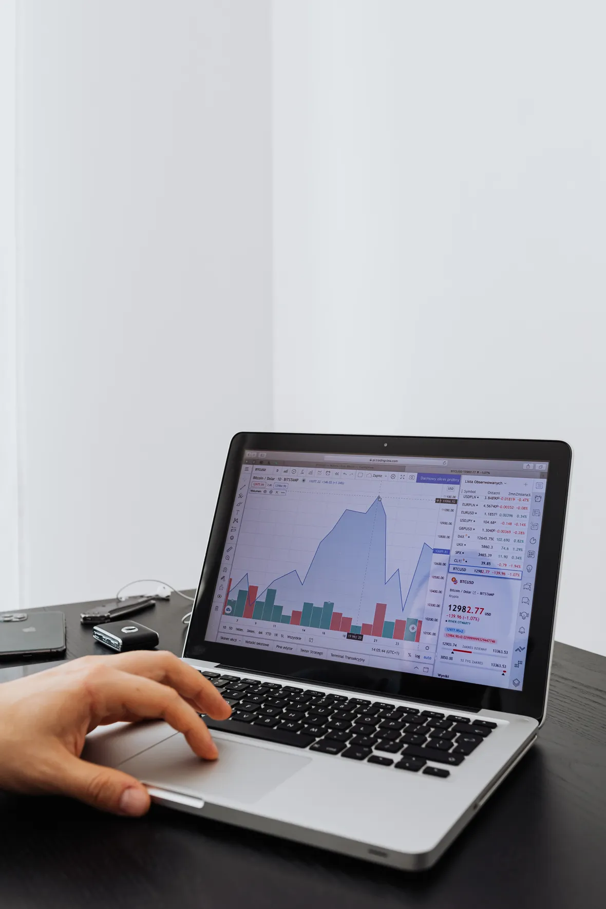 Person analysing financial performance data and business analytics on a laptop screen