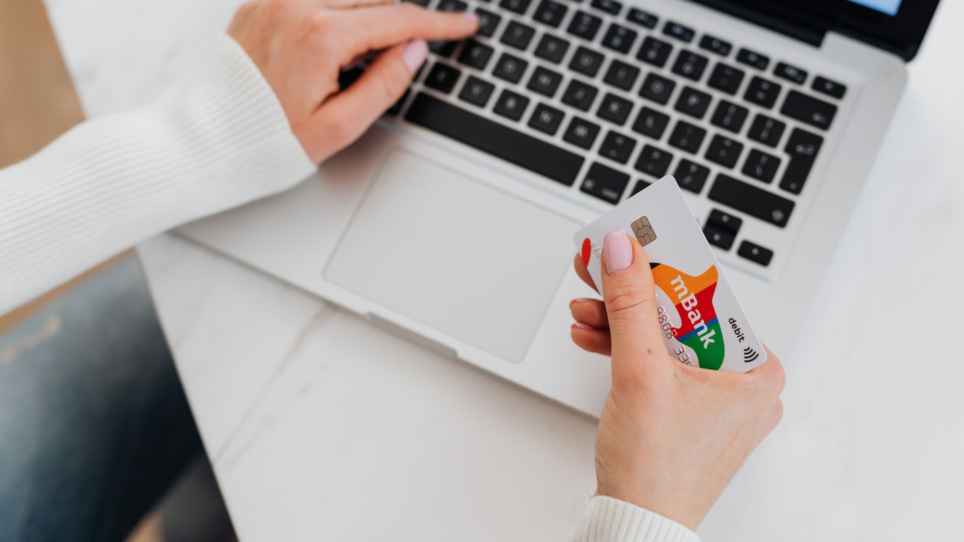 Modafinil Paypal Payment Option: A Comprehensive Guide Close-up of a person using a laptop and holding a credit card for online shopping — modafinil paypal payment option
