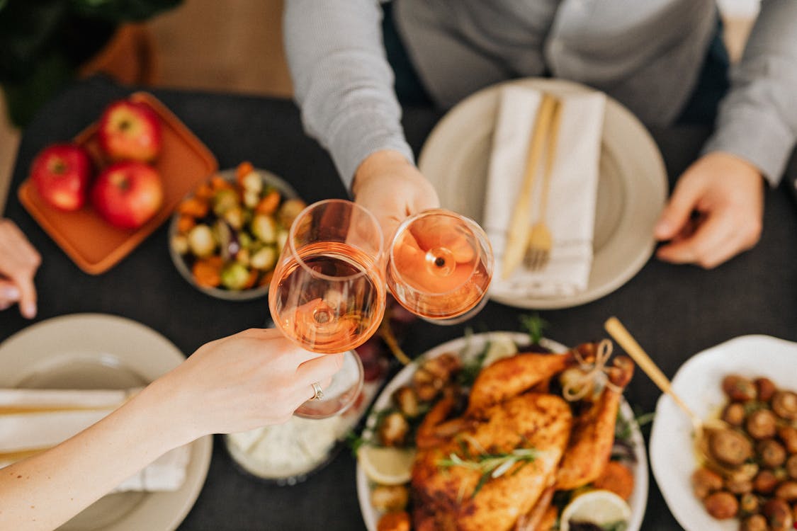 Free Food On The Table With Two People Having Wine Stock Photo