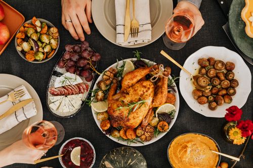Free Top-down view of a delicious roast chicken dinner surrounded by sides on a festive table. Stock Photo