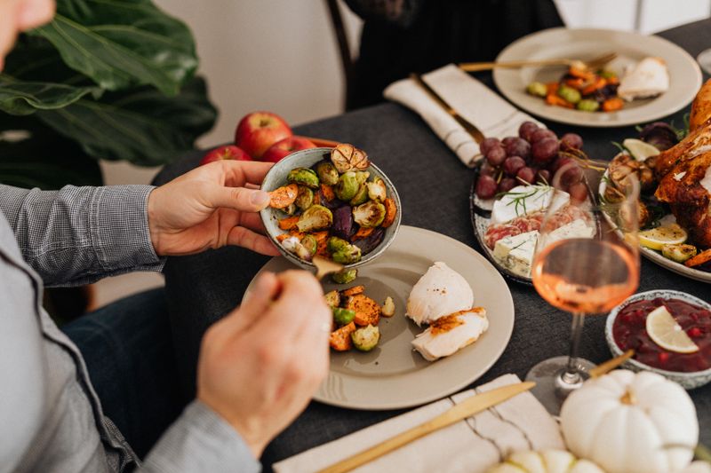 Friends sharing a colorful homemade dinner
