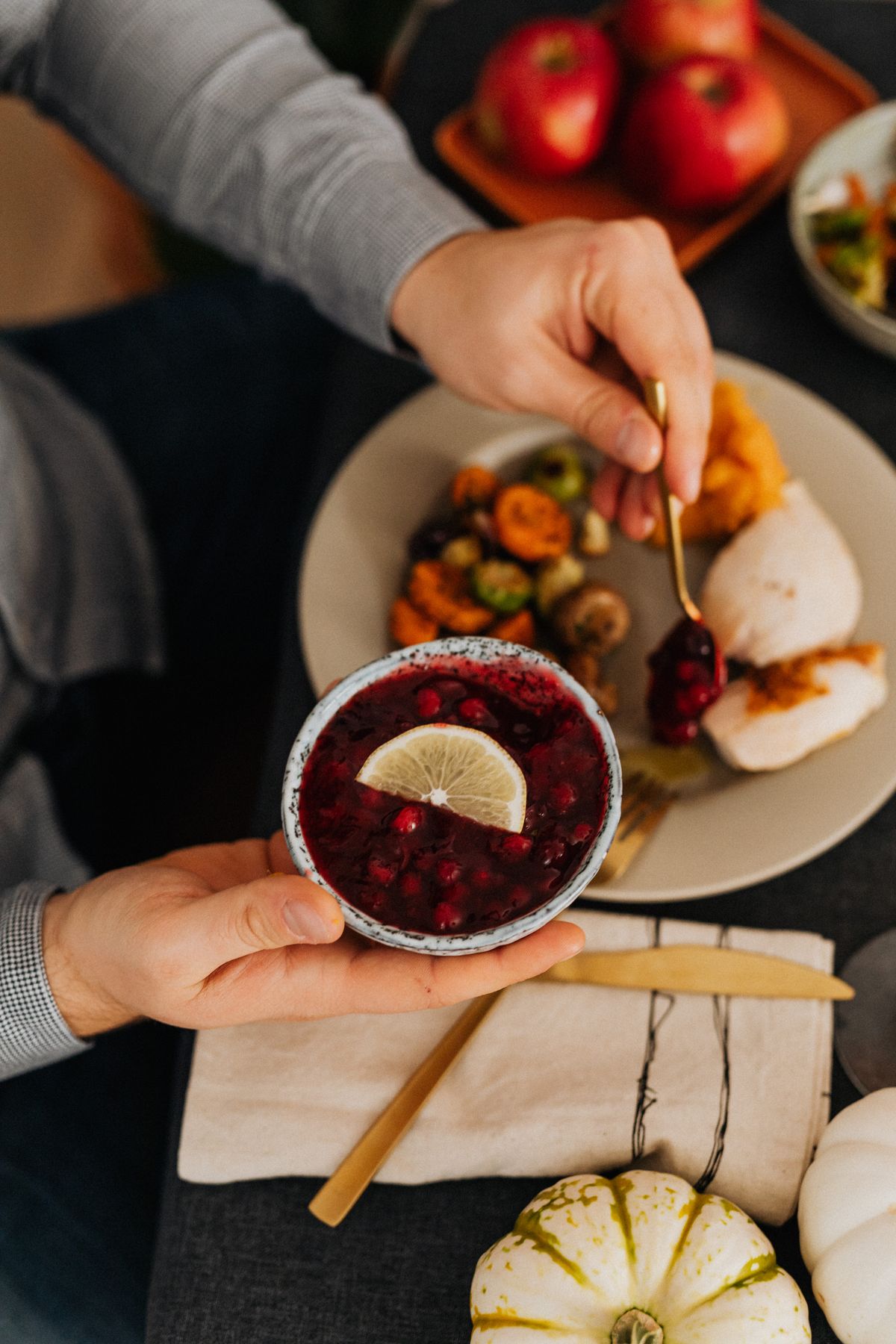 Roast turkey served with cranberry sauce on a festive table