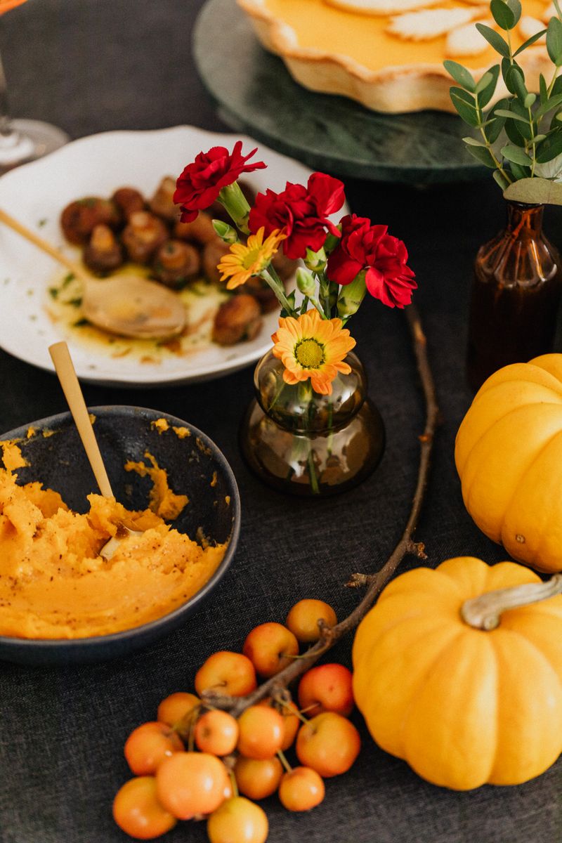 Beautiful autumn harvest food spread with pumpkins and seasonal dishes