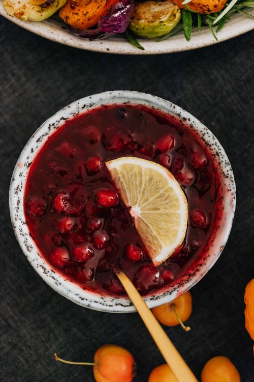 Free Top view of a bowl of cranberry sauce garnished with a lemon slice. Stock Photo
