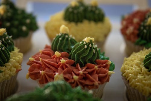 Green and Orange Icing on Cupcakes