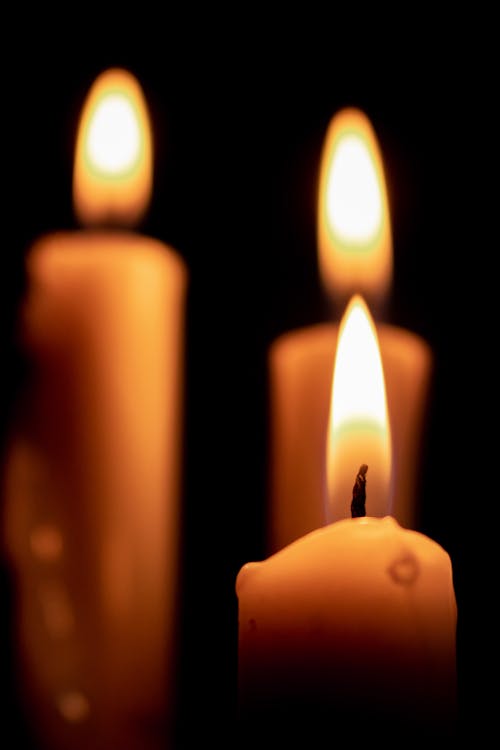 Free Close-Up Shot of Lighted Candles  Stock Photo