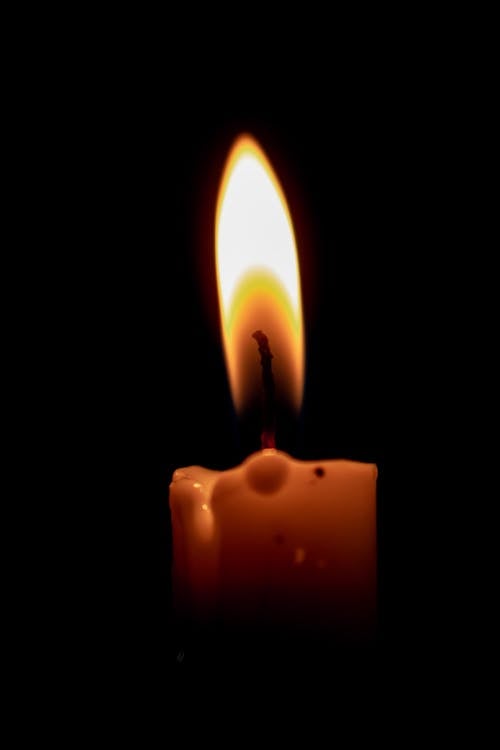 Free Close-Up Shot of a Lighted Candle  Stock Photo