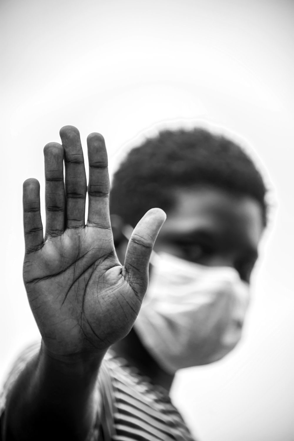Grayscale Photo of a Man Covering His Face · Free Stock Photo