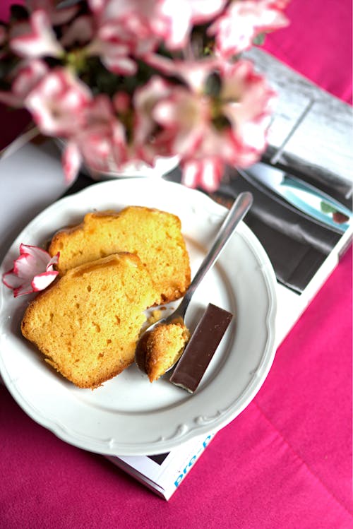 Cake on a white saucer. African violets