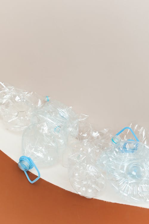 Free Clear Plastic Bottle on White Table Stock Photo