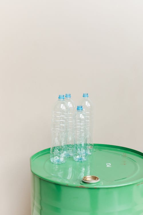 Clear Plastic Bottle on Green Container