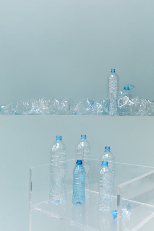 Clear Plastic Bottle on Clear Glass Table