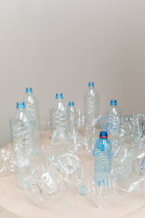 Clear Plastic Bottles on the Table