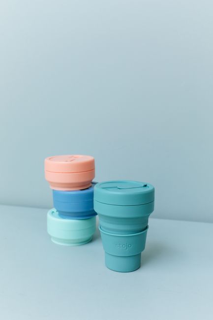 Close-up of colorful collapsible and reusable cups promoting eco-friendly sustainability.