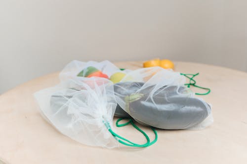 Close-Up Shot of Vegetables in a Reusable Bag