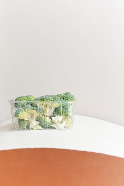 Close-Up Shot of Broccoli in a Plastic Container