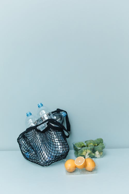 Close-Up Shot of Plastic Bottles in a Net