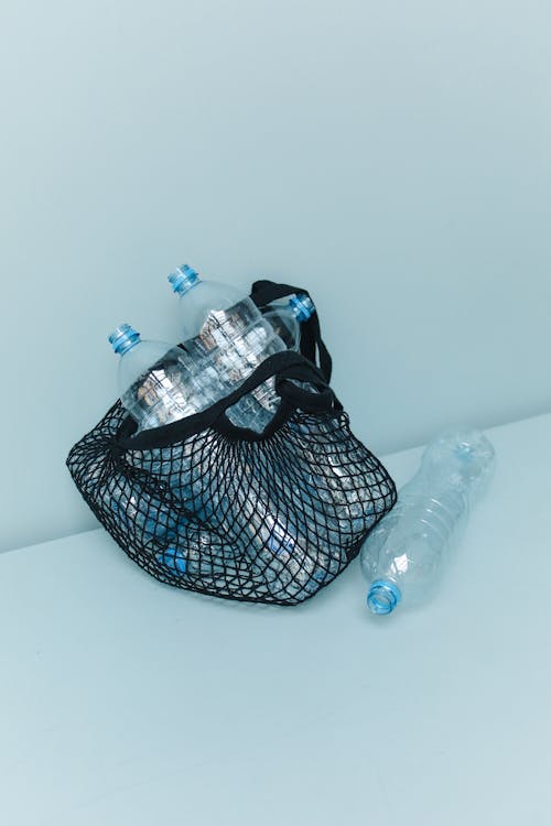 Close-Up Shot of Plastic Bottles in a Net