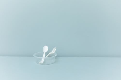 White Plastic Spoon on White Surface