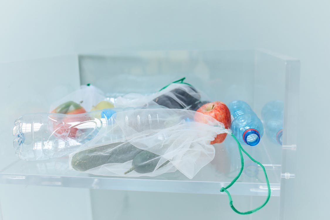 Plastic Bottles and Eco Bags in Container
