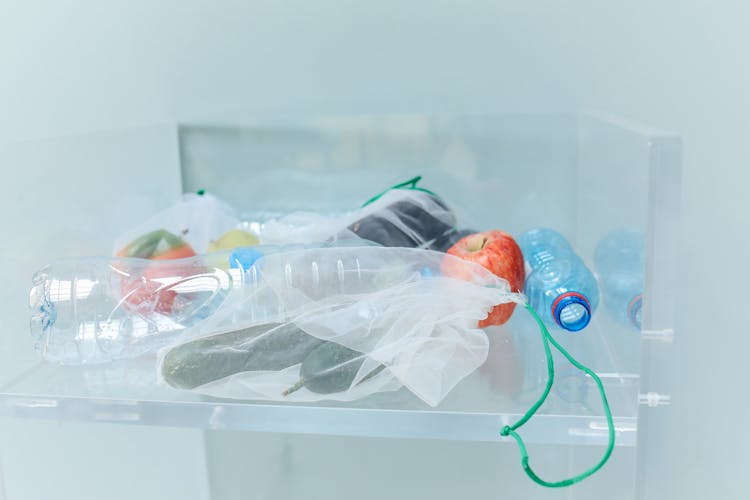 Plastic Bottles And Eco Bags In Container