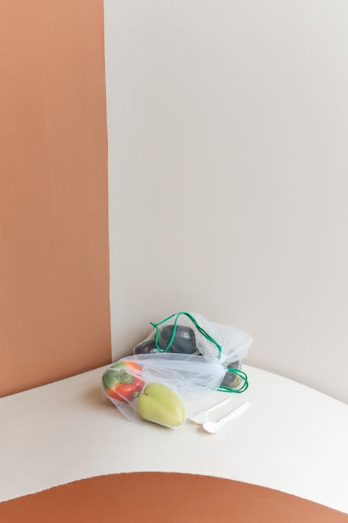 Bags with Vegetables in the Corner of the Table