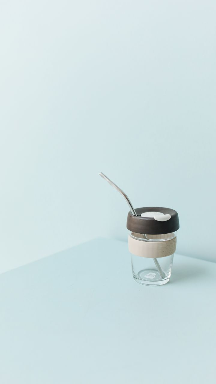 Clear straw holder with reusable straws displayed on a dollar tree coffee bar design