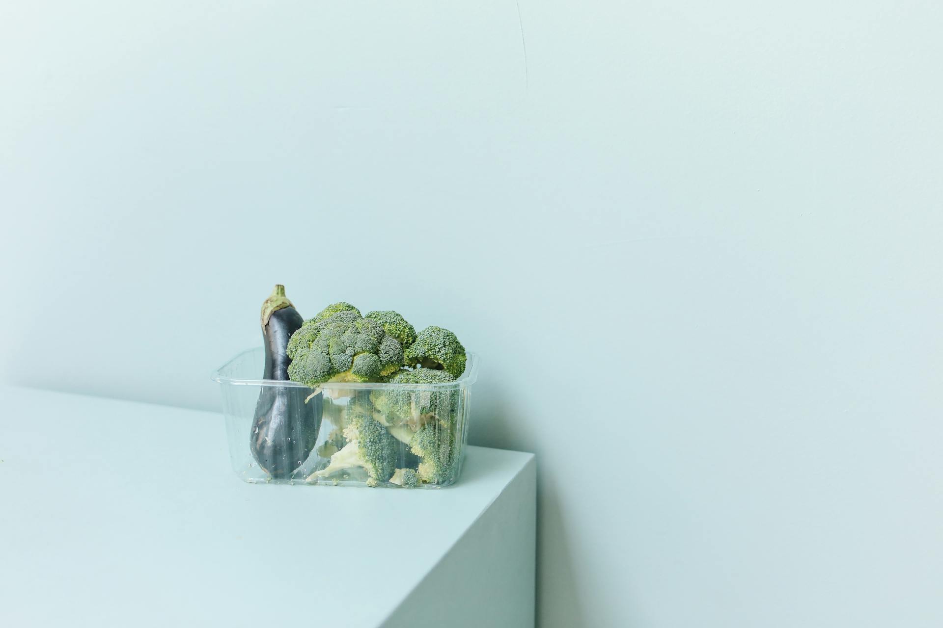 Close-Up Shot of Fresh Vegetables on a Plastic Container