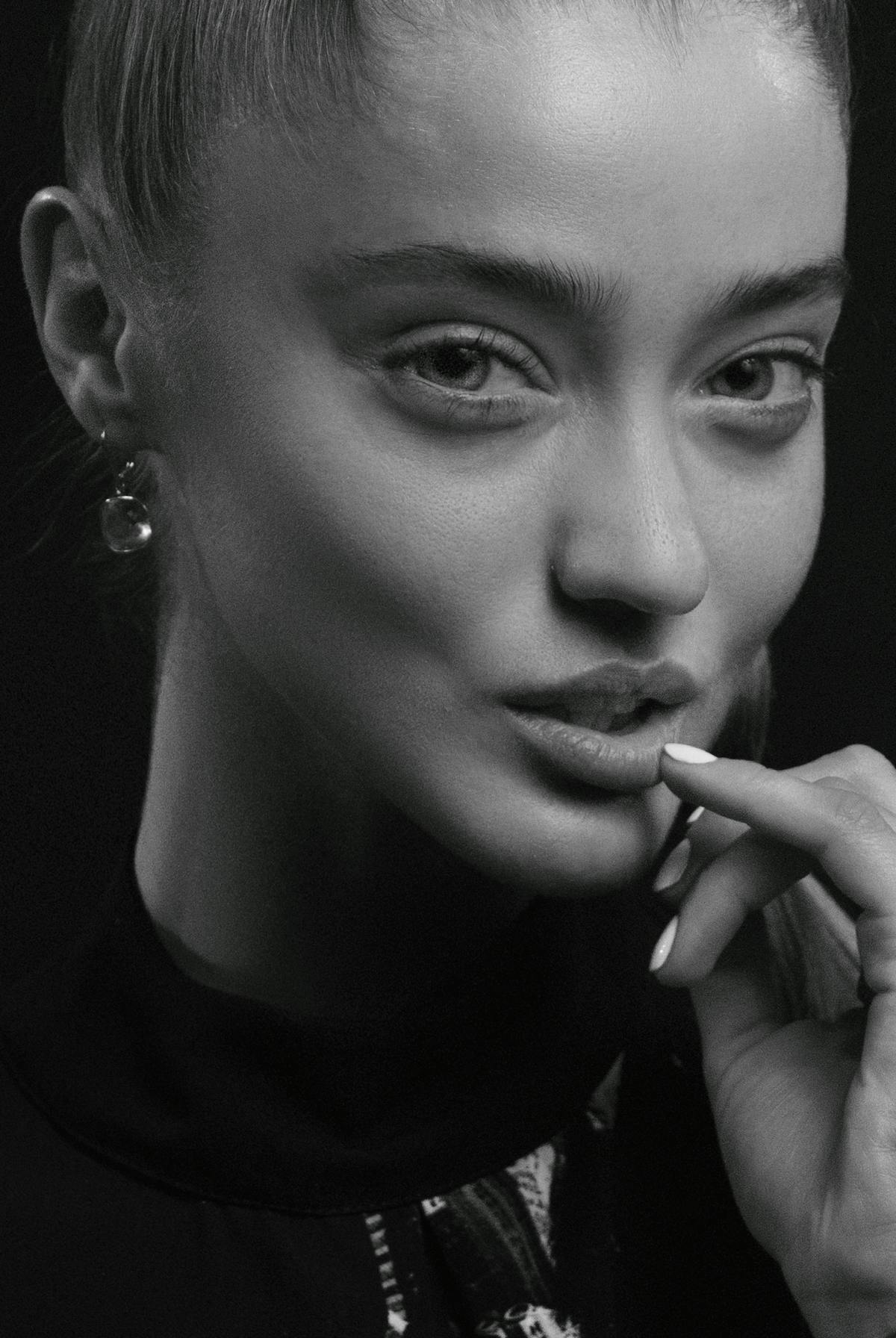 Person organizing tasks on a laptop and smartphone for productivity