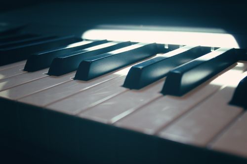 Free Detailed close-up of piano keys with dramatic lighting in Málaga, Spain. Stock Photo