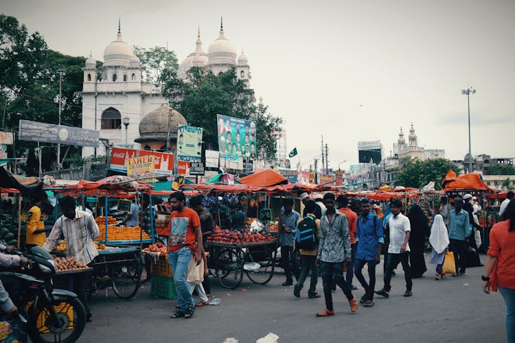 Crowded Street With Market Stalls
