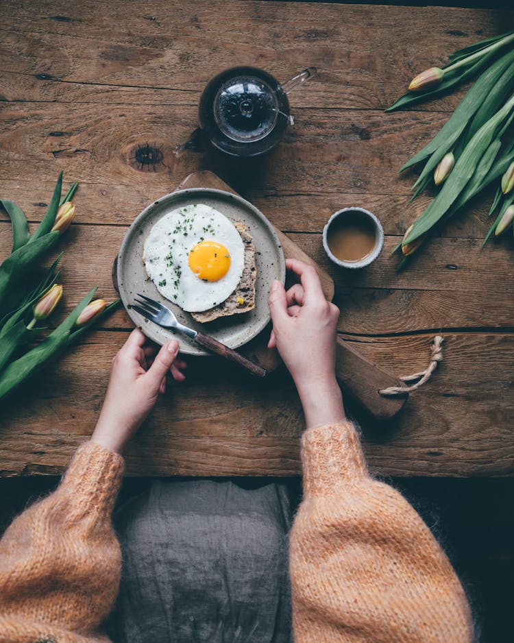 Woman Hands And Fried Egg Breakfast