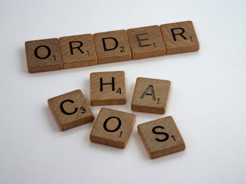 Close-Up Shot of Scrabble Tiles on a White Surface