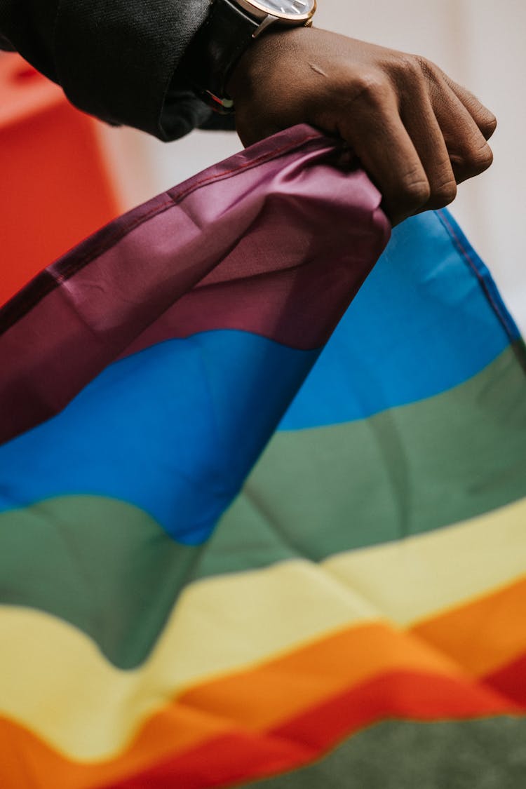 Unrecognizable African American Guy With Pride Flag During Parade