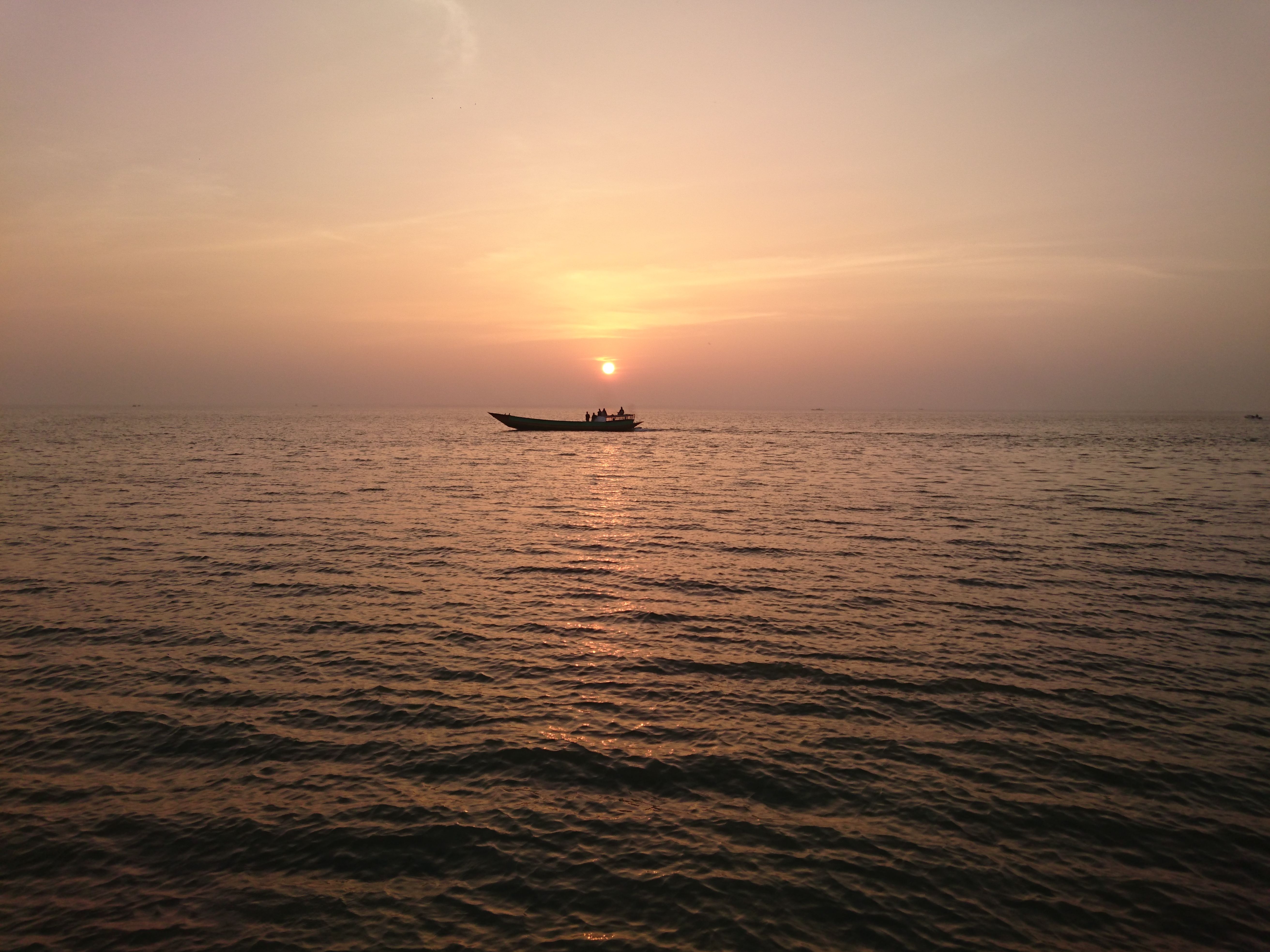 Silhouette of a Boat Sailing during Sunset · Free Stock Photo