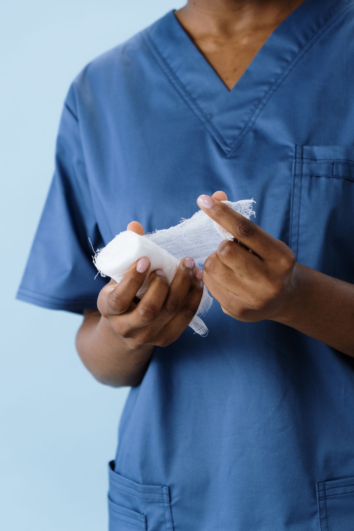 Healthcare professional preparing sterile medical dressing