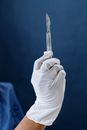 Close-Up Shot of a Person Holding a Scalpel