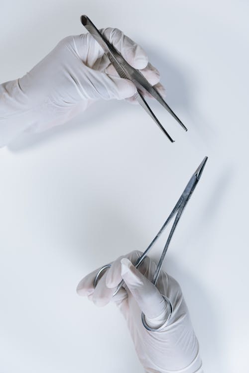 Close-Up Shot of a Person Holding Forceps