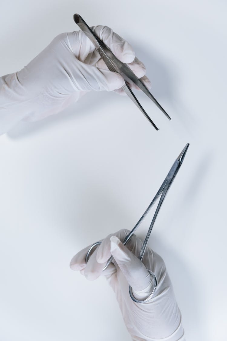 Close-Up Shot Of A Person Holding Forceps