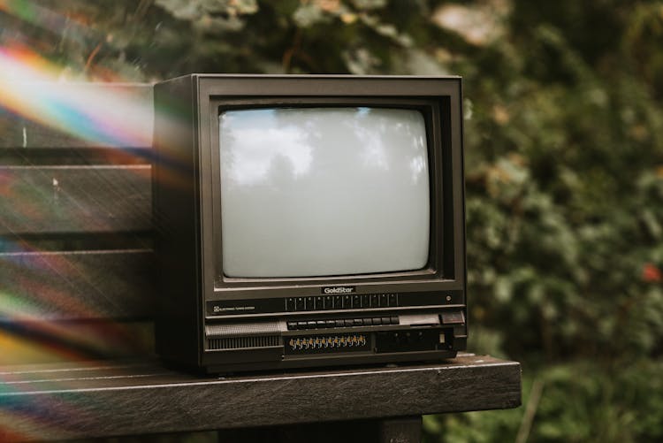 Retro TV Set On Bench In Park