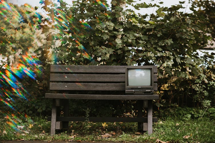 Vintage TV Set On Wooden Bench