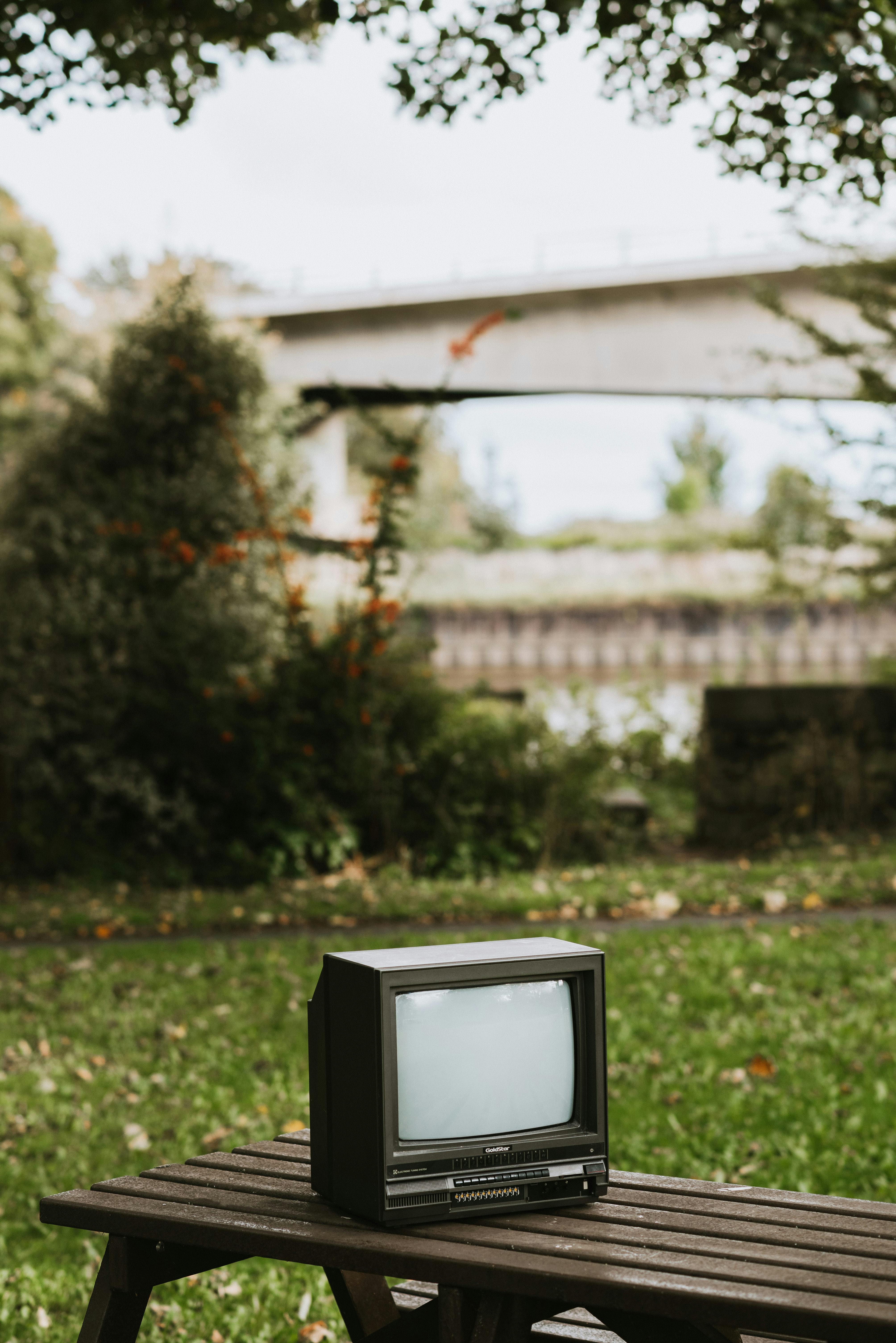 retro tv set on wooden bench